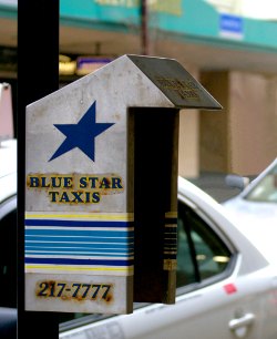 A phone box at a taxi stand